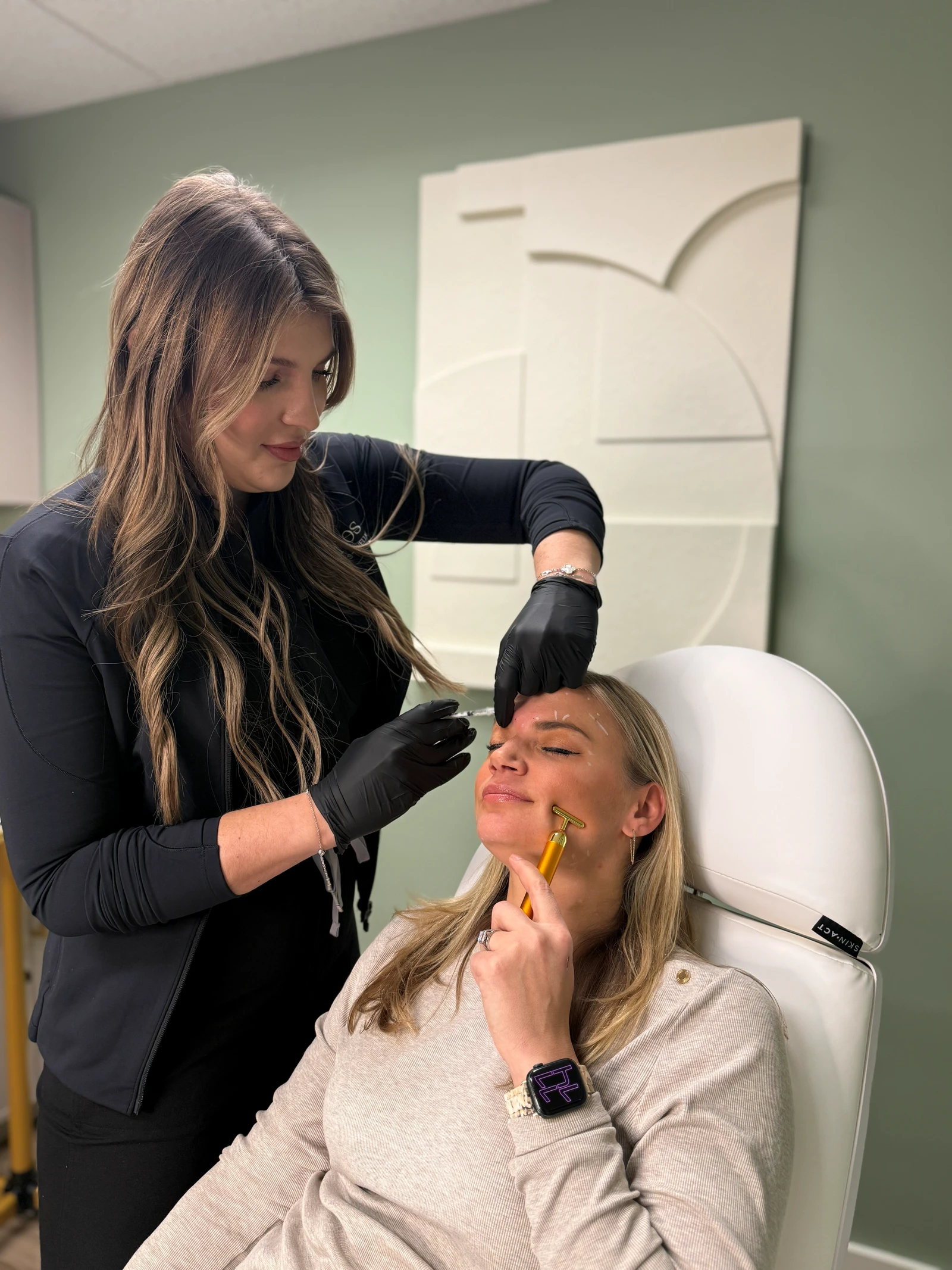 Milesa (Mimi) Jeremic, RN, performing a treatment on a patient at Ethos Hoboken